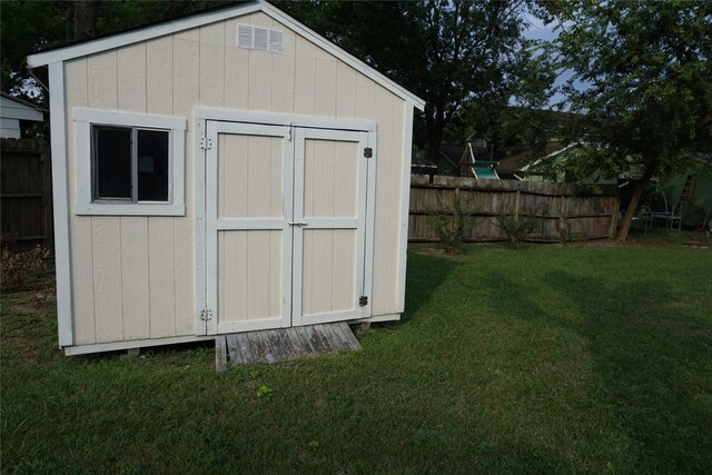 view of shed with fence