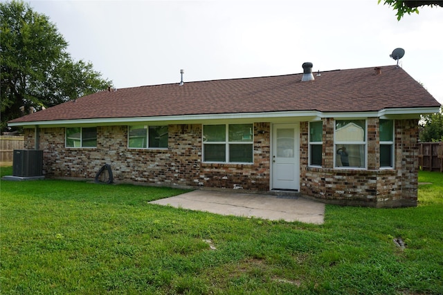 back of house featuring a yard, central AC, a patio area, and fence