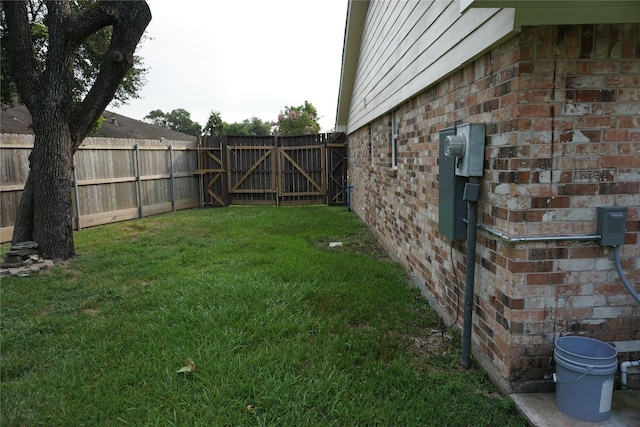 view of yard featuring a gate and fence