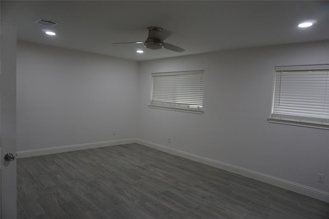 spare room with visible vents, baseboards, dark wood-style flooring, recessed lighting, and a ceiling fan