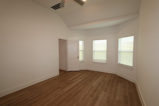 empty room with lofted ceiling, dark wood-type flooring, and ceiling fan