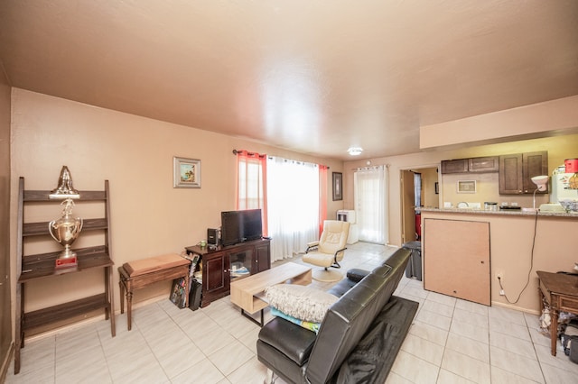 living room with light tile patterned floors