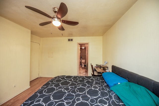 bedroom featuring ceiling fan and hardwood / wood-style flooring