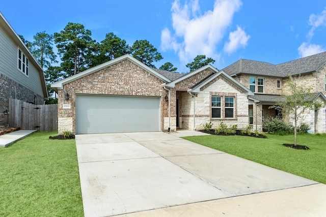 view of front facade featuring a garage and a front yard