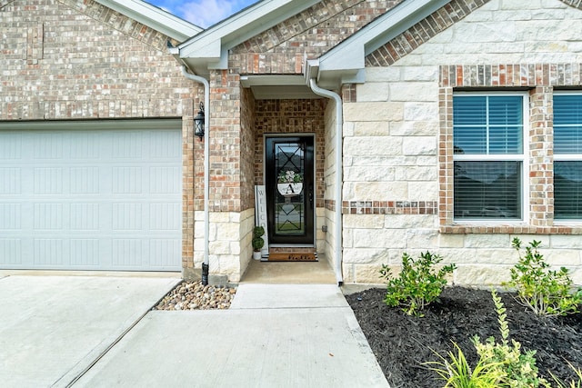 view of exterior entry featuring a garage