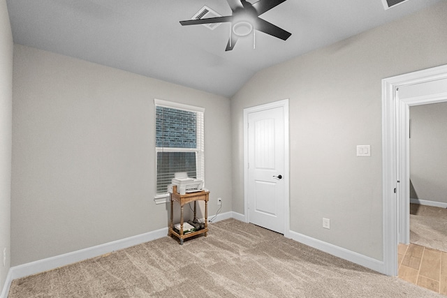 carpeted bedroom featuring ceiling fan and vaulted ceiling