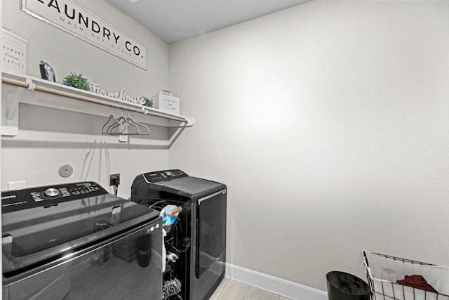 laundry area with independent washer and dryer