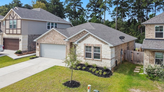 view of front of house with a garage and a front yard