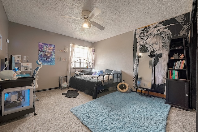 carpeted bedroom with ceiling fan and a textured ceiling