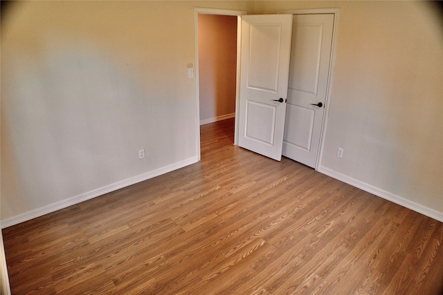 unfurnished bedroom featuring wood-type flooring