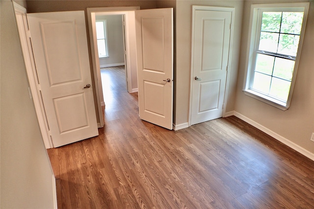 empty room with wood-type flooring