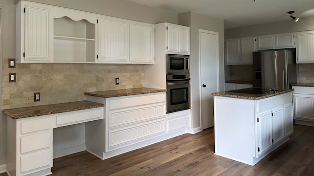 kitchen featuring dark hardwood / wood-style flooring, tasteful backsplash, a kitchen island, and stainless steel appliances