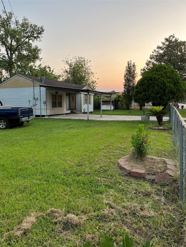 view of yard at dusk