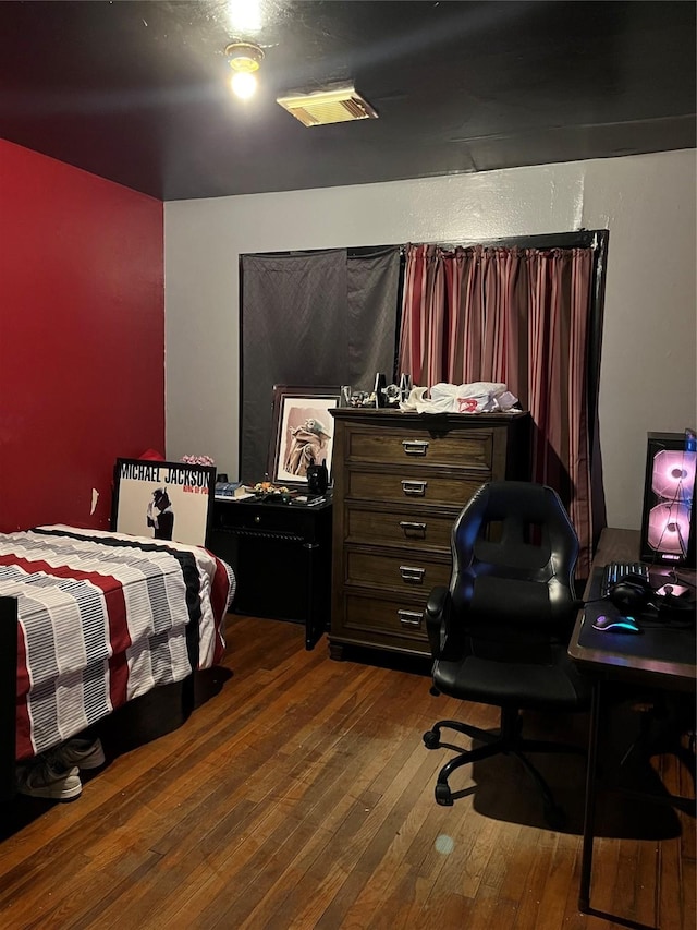 bedroom featuring dark wood-type flooring