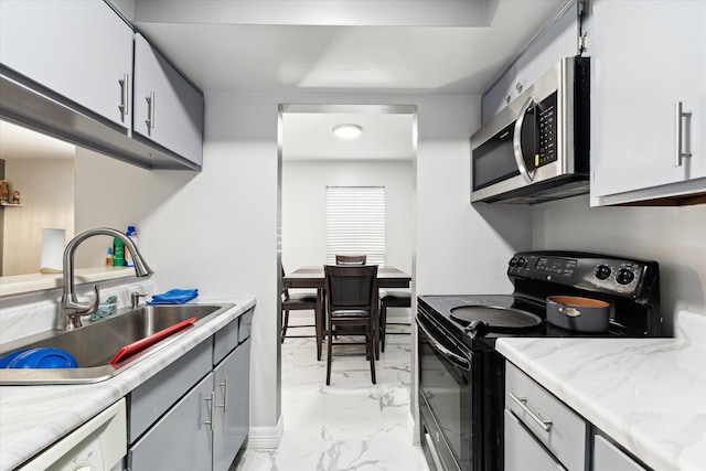 kitchen with light tile patterned flooring, sink, electric range, gray cabinetry, and dishwasher