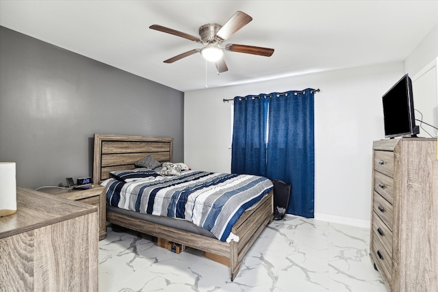 bedroom with ceiling fan and light tile patterned flooring