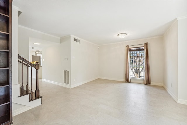 spare room featuring crown molding