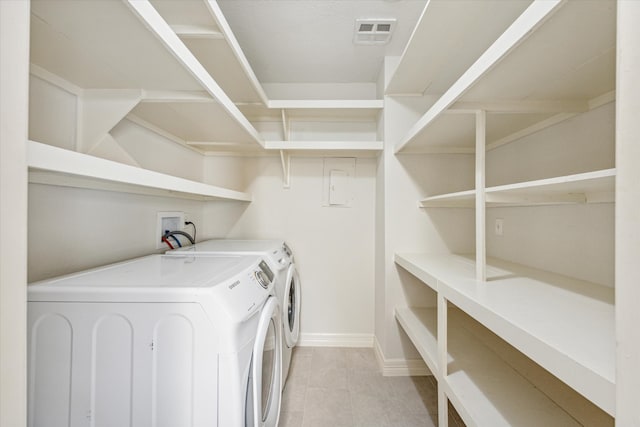 washroom featuring light tile patterned flooring and independent washer and dryer