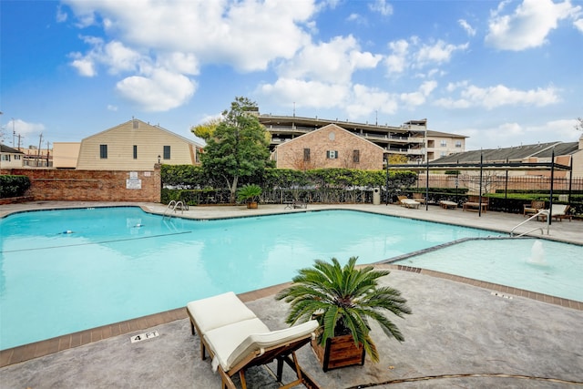 view of pool featuring a patio