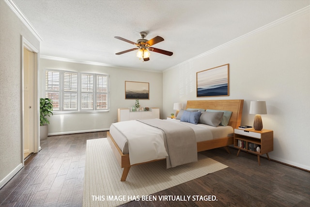 bedroom with dark wood-type flooring, a textured ceiling, ceiling fan, and crown molding