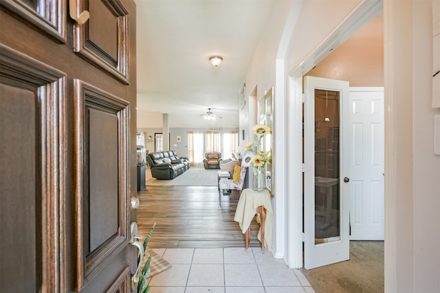 foyer entrance featuring ceiling fan and light hardwood / wood-style flooring