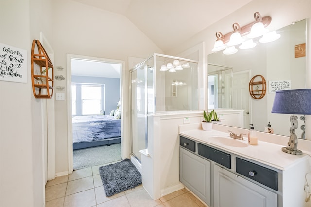 bathroom featuring walk in shower, lofted ceiling, tile patterned floors, and vanity