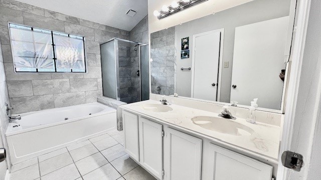 bathroom with tile patterned flooring, plus walk in shower, and vanity