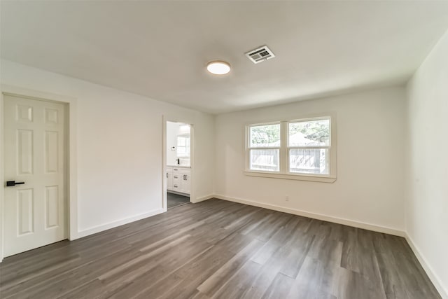 unfurnished room with dark hardwood / wood-style floors