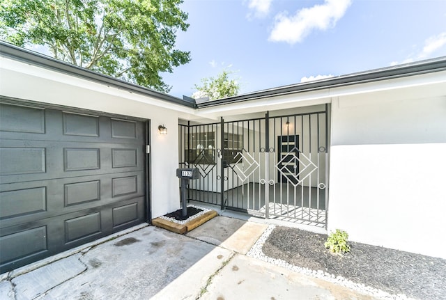 doorway to property featuring a garage