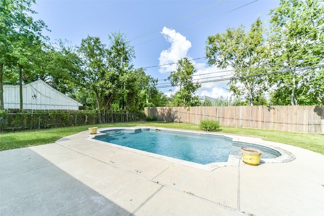 view of pool with a patio and a hot tub