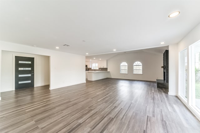 unfurnished living room featuring light hardwood / wood-style flooring