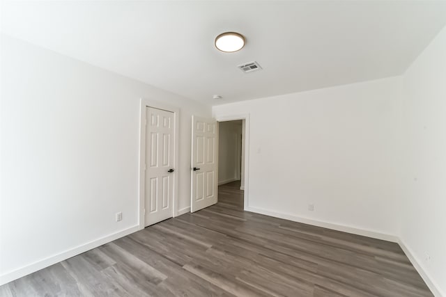 unfurnished room featuring hardwood / wood-style floors