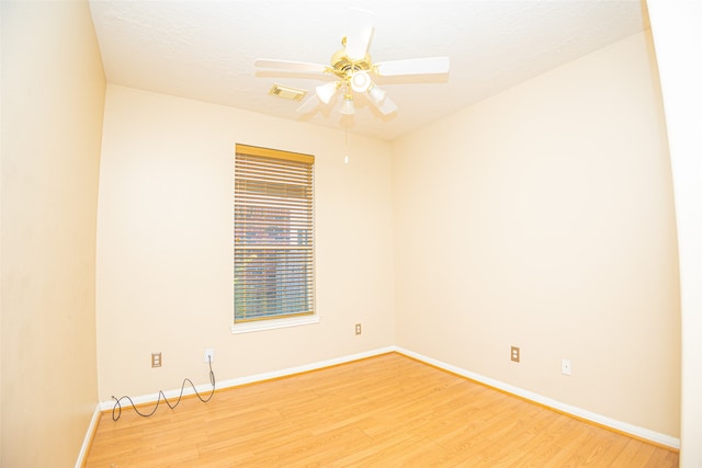 unfurnished room with ceiling fan and light wood-type flooring