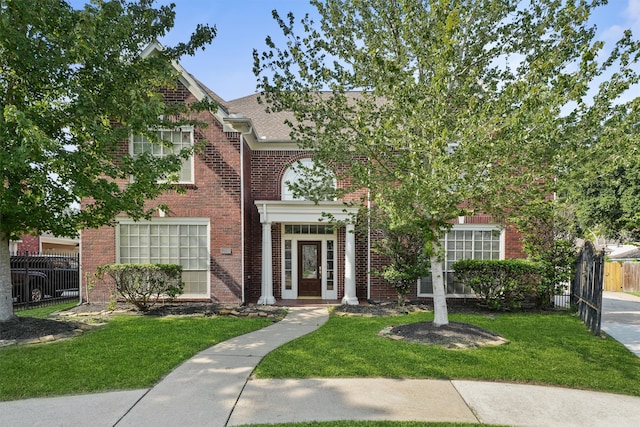 view of front of property with a front lawn