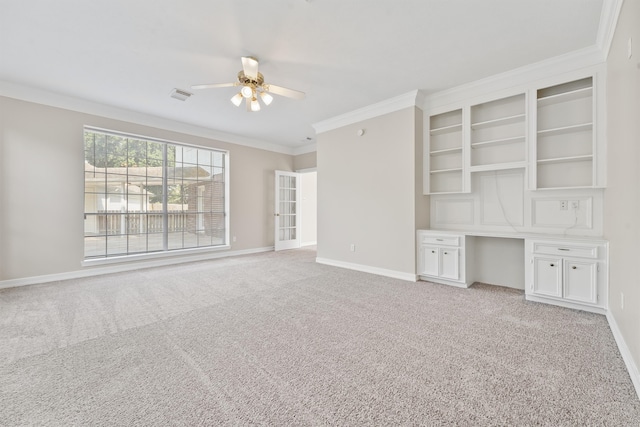 unfurnished living room featuring ceiling fan, crown molding, and light carpet