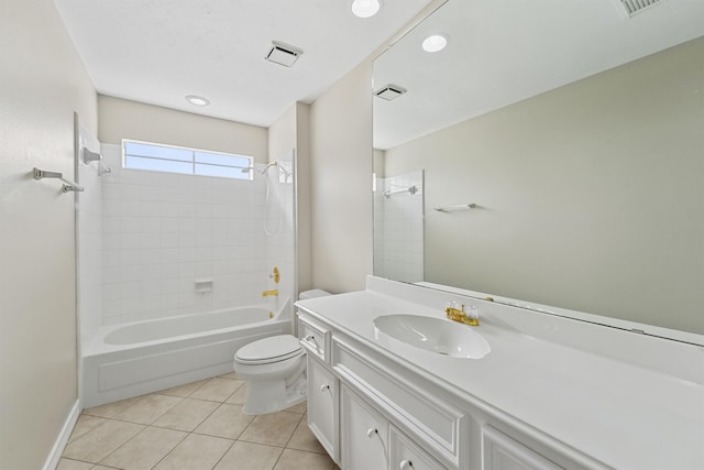 full bathroom with tiled shower / bath, toilet, tile patterned floors, and vanity