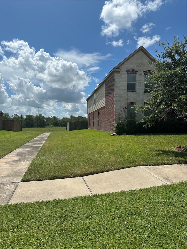 view of property exterior with a lawn