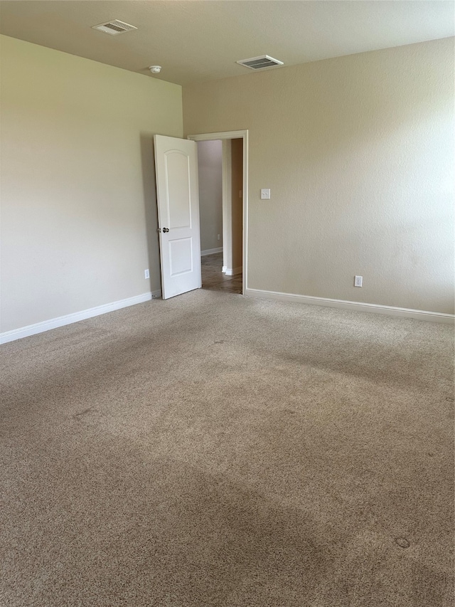 spare room featuring carpet