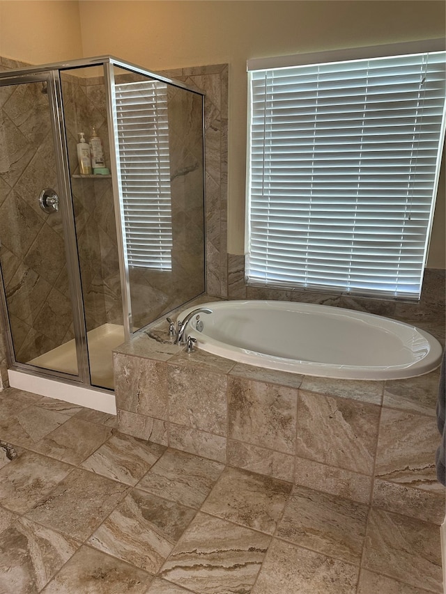 bathroom with plus walk in shower and tile patterned flooring