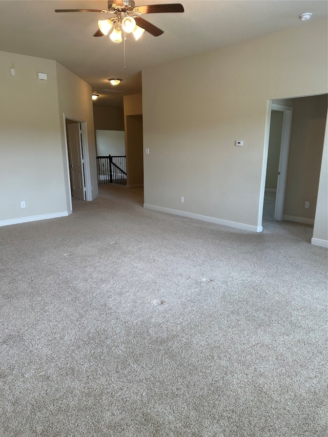 empty room featuring carpet and ceiling fan