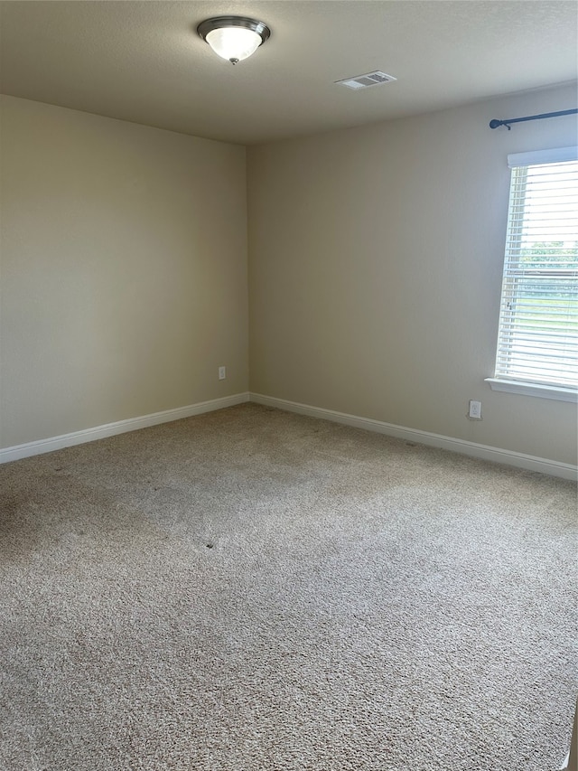 spare room featuring carpet floors