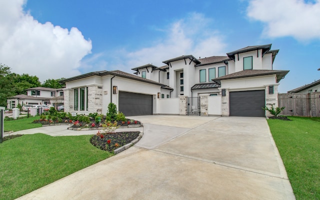 view of front facade with a garage and a front lawn