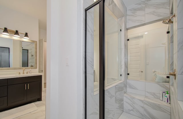 bathroom with tile patterned floors, vanity, and walk in shower