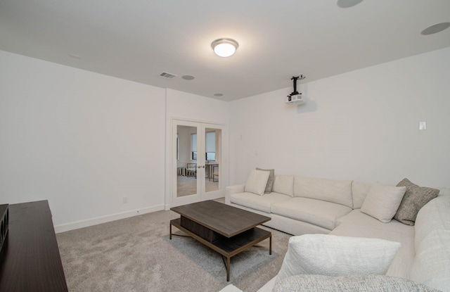 living room with light carpet and french doors