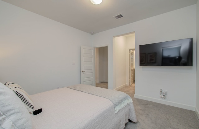 bedroom featuring light carpet