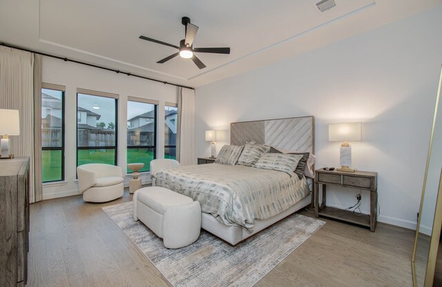 bedroom featuring ceiling fan and light hardwood / wood-style floors