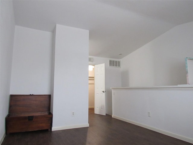 2110 Wilcrest Dr Unit 123, Houston, TX 77042 - empty room featuring wood finished floors and vaulted ceiling