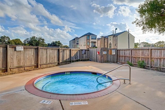 2110 Wilcrest Dr Unit 123, Houston, TX 77042 - view of swimming pool featuring a community hot tub and a fenced backyard