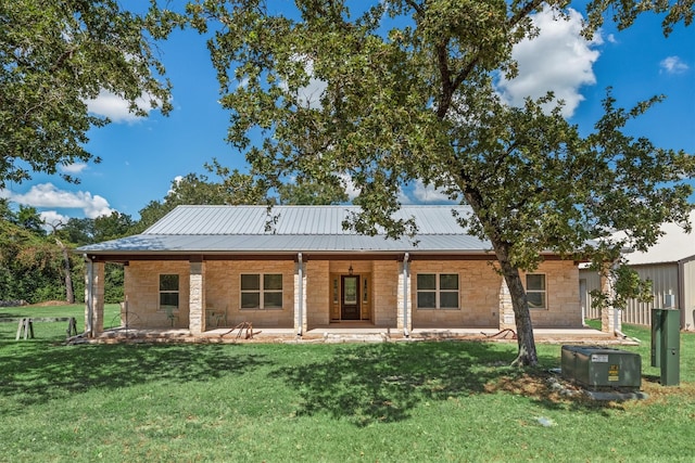 rear view of house with a yard