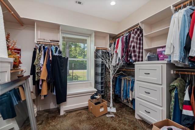 spacious closet with dark carpet